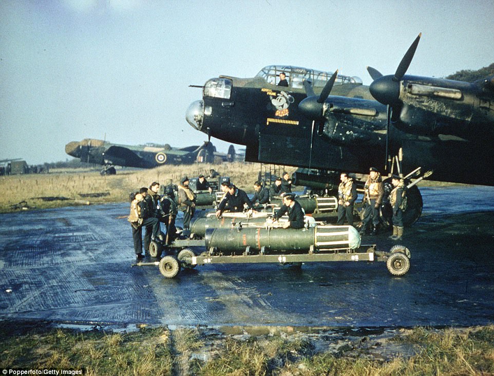 Sea mines being readied to load into a Lancaster's bomb bay.
