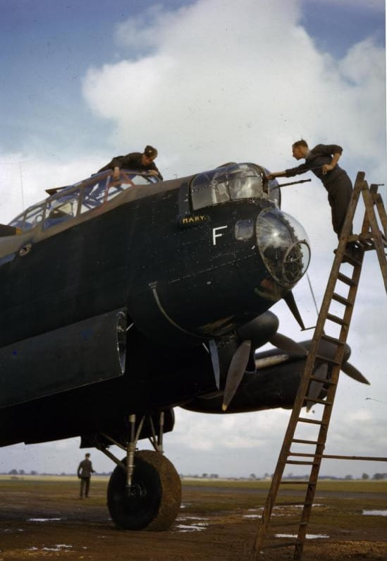 Lancaster R5666 KM-F gets its screen cleaned and guns maintained.
